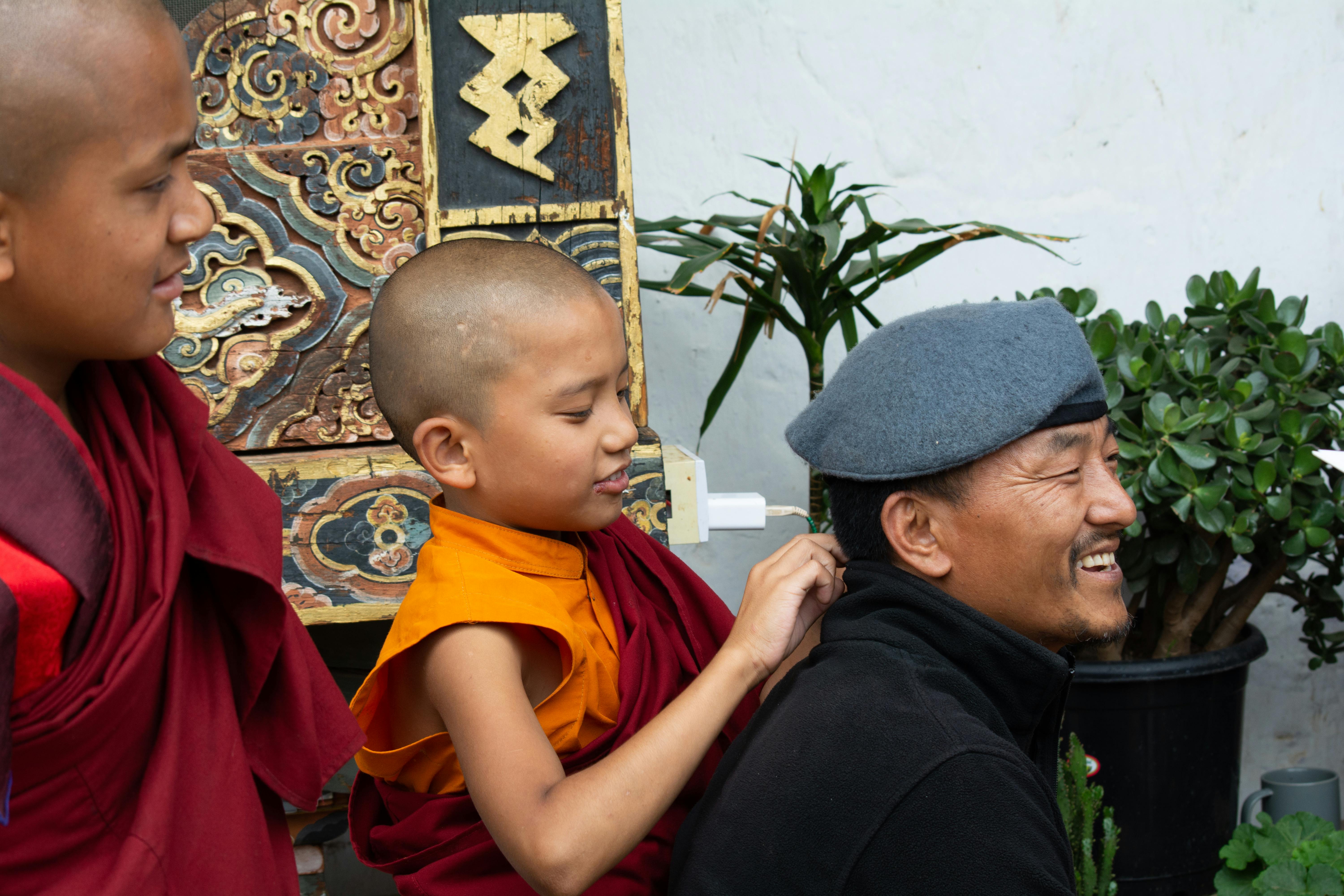 Young monk and elder smiling